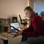 Florida homeowner creating a digital home inventory checklist with photos of electronics and furniture.